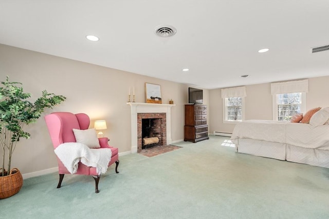 bedroom featuring light carpet, visible vents, a fireplace, and a baseboard radiator