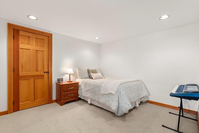 bedroom with recessed lighting, baseboards, and light colored carpet