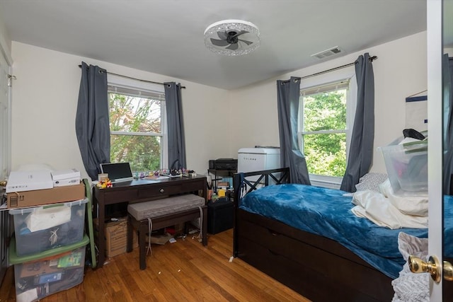 70 Puritan Rd, Bourne, MA 02532 - bedroom featuring wood finished floors, multiple windows, and a desk