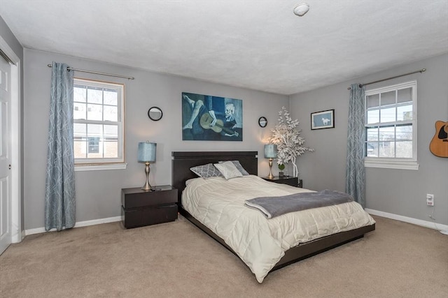 bedroom featuring light colored carpet