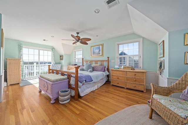 bedroom featuring light hardwood / wood-style floors, multiple windows, and ceiling fan