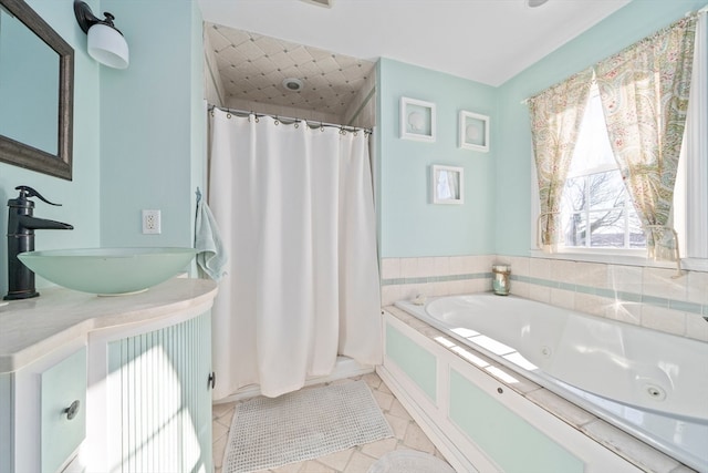 bathroom with independent shower and bath, tile patterned flooring, and vanity