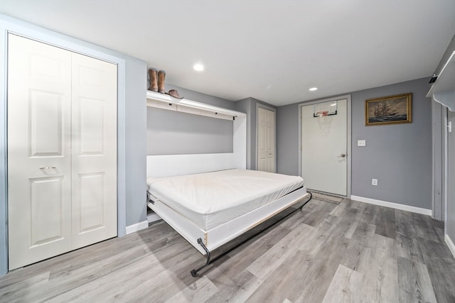 bedroom with light hardwood / wood-style floors