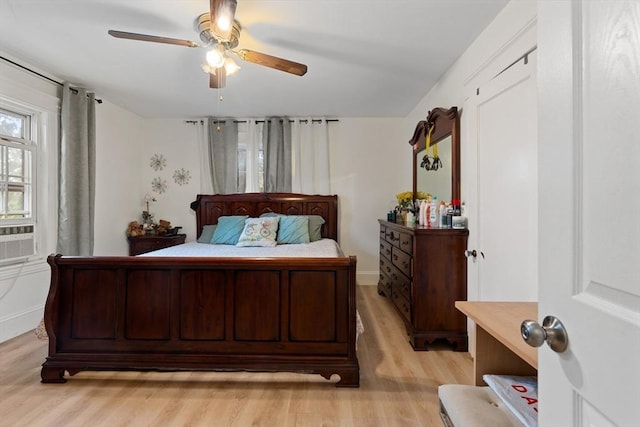 bedroom featuring ceiling fan and light hardwood / wood-style flooring