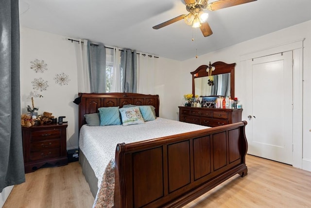 bedroom with ceiling fan and light hardwood / wood-style flooring