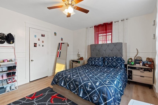 bedroom with hardwood / wood-style flooring and ceiling fan