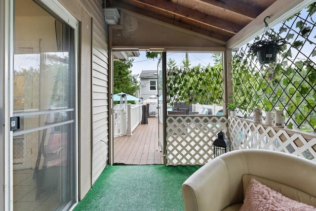 sunroom / solarium with lofted ceiling and wood ceiling