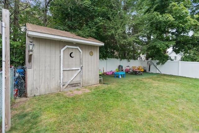 view of outdoor structure with a lawn