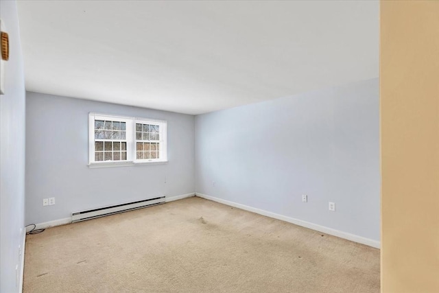 unfurnished room featuring light carpet and a baseboard radiator