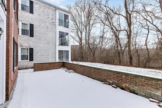 view of yard layered in snow