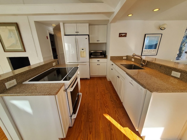 kitchen featuring white cabinets, dark hardwood / wood-style flooring, white appliances, and sink