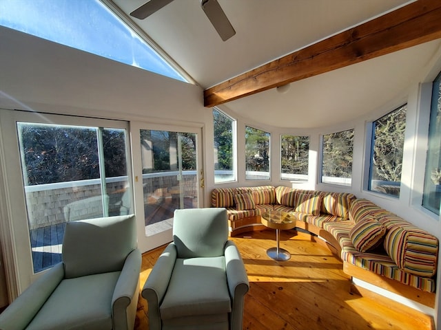 sunroom with vaulted ceiling with beams and ceiling fan