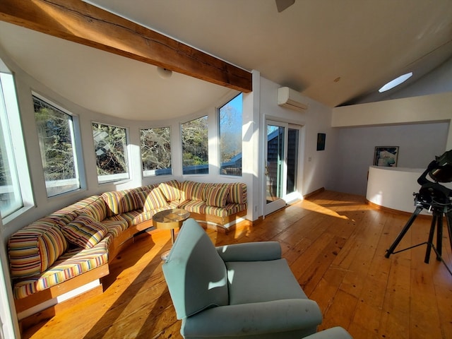 interior space featuring a wall mounted AC and vaulted ceiling with beams