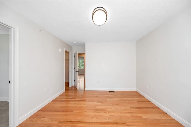 spare room featuring light hardwood / wood-style floors