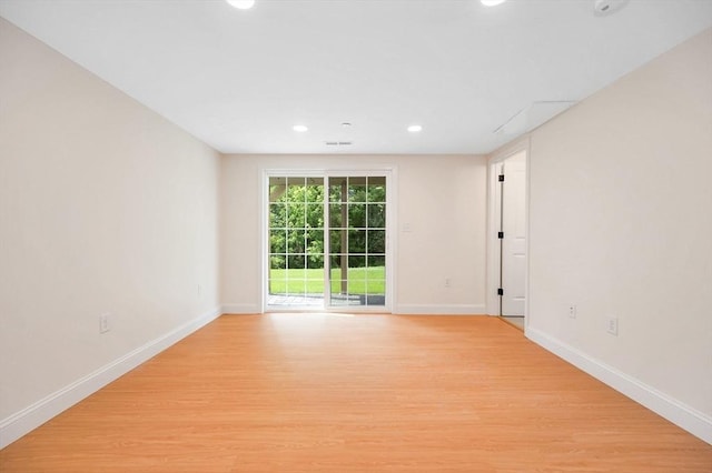 unfurnished room with light wood-type flooring