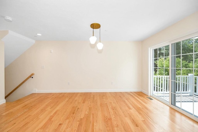 interior space featuring lofted ceiling and light wood-type flooring