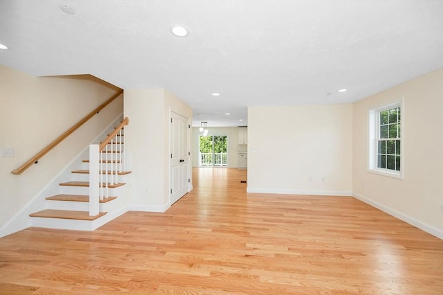 unfurnished room featuring light hardwood / wood-style floors and a healthy amount of sunlight