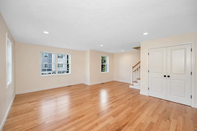 unfurnished room featuring light hardwood / wood-style floors