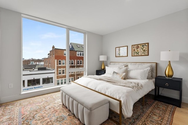 bedroom with hardwood / wood-style flooring