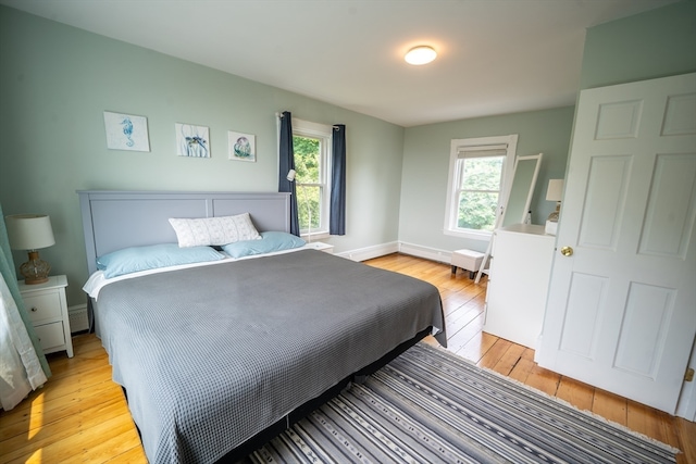 bedroom with light hardwood / wood-style floors