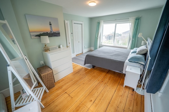 bedroom featuring light hardwood / wood-style flooring and a closet