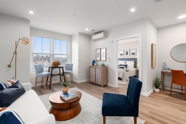 10 Somerset Unit 201, Winthrop, MA 02152 - living area featuring a wall mounted air conditioner, light wood-style flooring, and recessed lighting