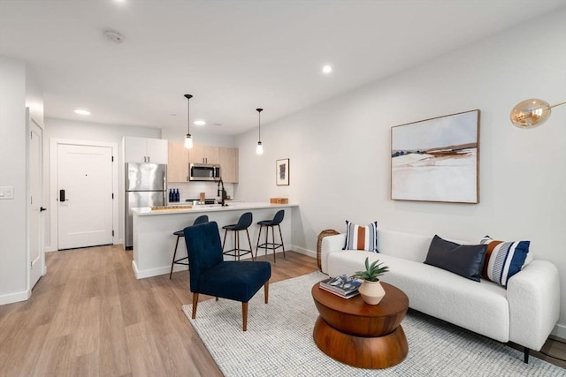 10 Somerset Unit 201, Winthrop, MA 02152 - living area featuring light wood-style floors and recessed lighting