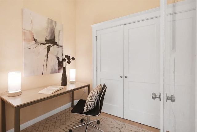office space featuring baseboards
