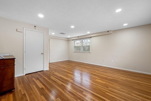 empty room featuring hardwood / wood-style flooring