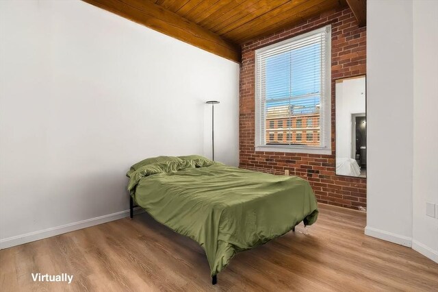 21 Wingate Unit 606, Haverhill, MA 01832 - bedroom featuring brick wall, wooden ceiling, and wood finished floors