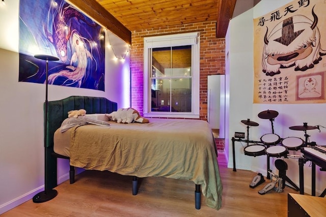 21 Wingate Unit 606, Haverhill, MA 01832 - bedroom with wood finished floors, brick wall, and wood ceiling