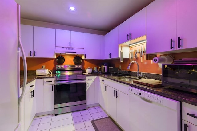 21 Wingate Unit 606, Haverhill, MA 01832 - kitchen featuring white appliances, red cabinetry, under cabinet range hood, light tile patterned floors, and recessed lighting