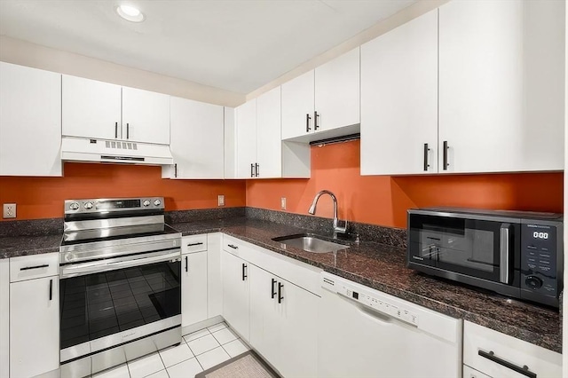 21 Wingate Unit 606, Haverhill, MA 01832 - kitchen with electric range, under cabinet range hood, dishwasher, white cabinets, and light tile patterned floors