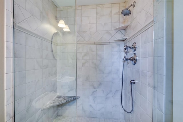 full bathroom with tiled shower