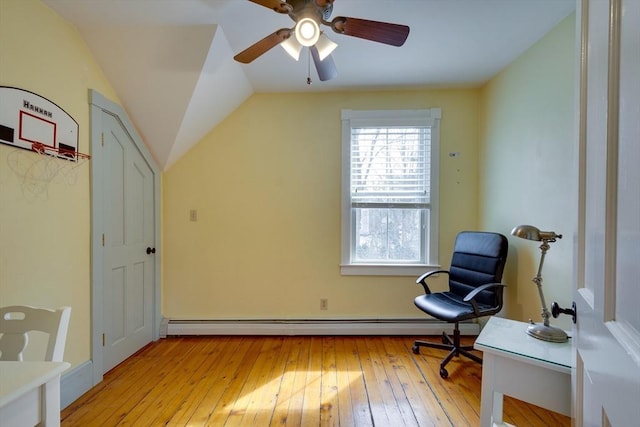 living area featuring a baseboard heating unit, light wood-style flooring, and vaulted ceiling