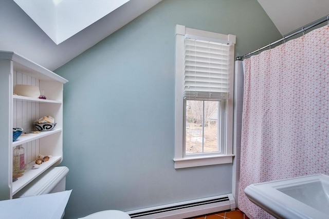 bathroom with baseboard heating, curtained shower, toilet, and vaulted ceiling