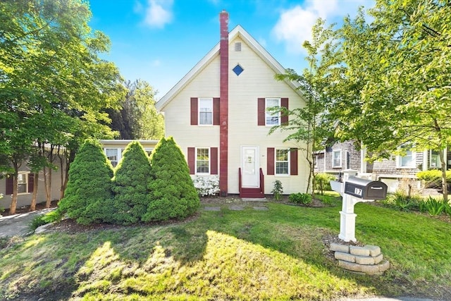 17 S High St, Ashburnham, MA 01430 - view of front of property featuring a chimney, a front yard, and entry steps