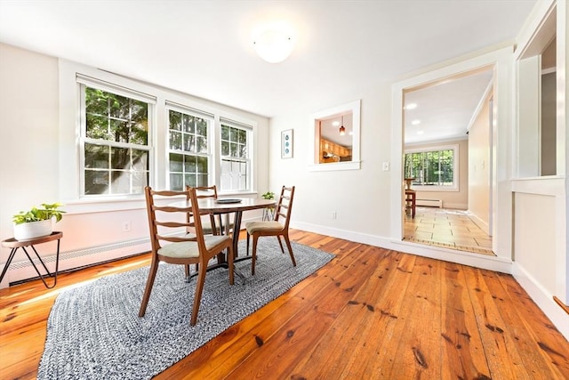 17 S High St, Ashburnham, MA 01430 - dining area with a baseboard radiator, wood-type flooring, and baseboards