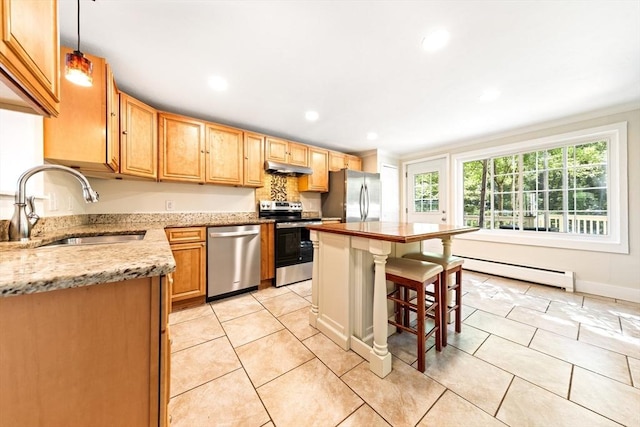 17 S High St, Ashburnham, MA 01430 - kitchen featuring stainless steel appliances, a baseboard radiator, a sink, under cabinet range hood, and a center island