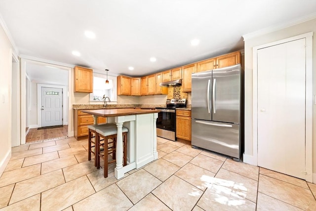 17 S High St, Ashburnham, MA 01430 - kitchen with stainless steel appliances, crown molding, light tile patterned floors, recessed lighting, and under cabinet range hood