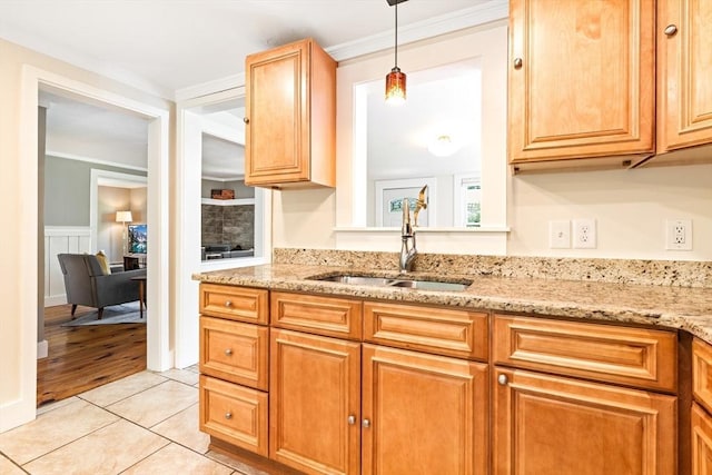 17 S High St, Ashburnham, MA 01430 - kitchen with a sink, light stone countertops, crown molding, light tile patterned flooring, and hanging light fixtures