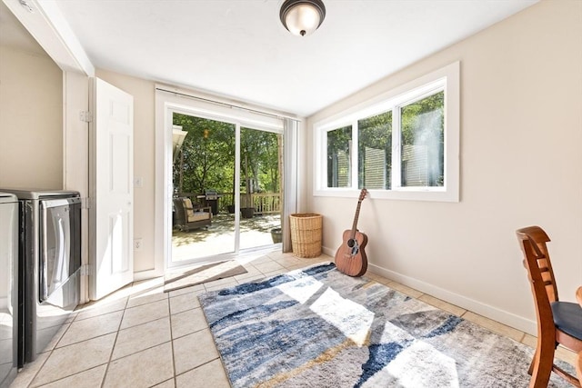 17 S High St, Ashburnham, MA 01430 - bedroom with washing machine and dryer, access to outside, light tile patterned floors, and baseboards