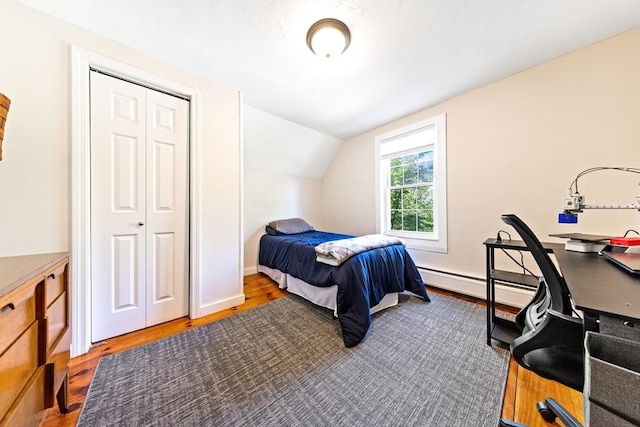 17 S High St, Ashburnham, MA 01430 - bedroom with wood finished floors, lofted ceiling, a baseboard heating unit, and baseboards