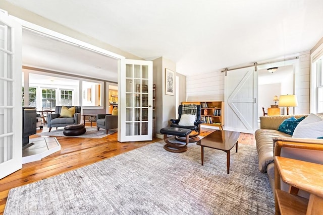 17 S High St, Ashburnham, MA 01430 - living room with a barn door, hardwood / wood-style flooring, and french doors