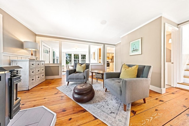17 S High St, Ashburnham, MA 01430 - living room featuring ornamental molding, light wood-style floors, stairs, and baseboards