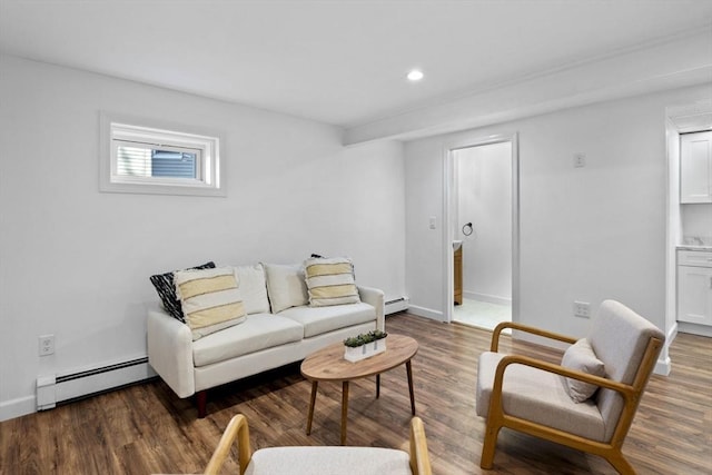 living room featuring baseboard heating and dark wood-type flooring