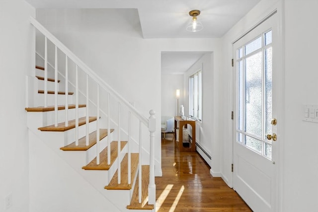 entryway with hardwood / wood-style flooring