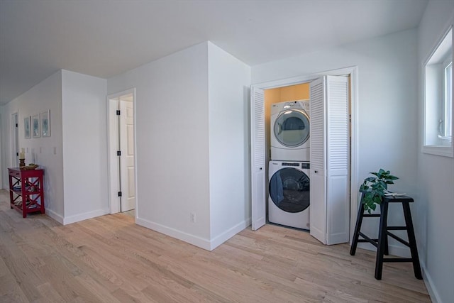 401 N End Blvd, Salisbury, MA 01952 - laundry room featuring estacked washer and dryer and light wood-type flooring