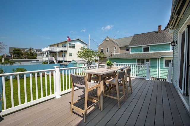 401 N End Blvd, Salisbury, MA 01952 - wooden deck featuring outdoor dining area, a residential view, and a fenced backyard