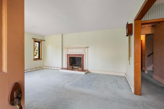 unfurnished living room featuring carpet flooring, stairs, and a fireplace